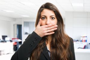 Woman shutting her mouth